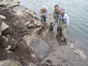 Pat Druckenmiller and collegues pose at the outcrop.