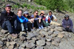 The crew found dozens of dinosaur tracks along one Yukon River beach. From left: Paul McCarthy, Julie Rousseau, Meghan Shay, Katherine Anderson, Meg O’Connor, Pat Druckenmiller, and J»rn Hurum. Photo by Kevin May